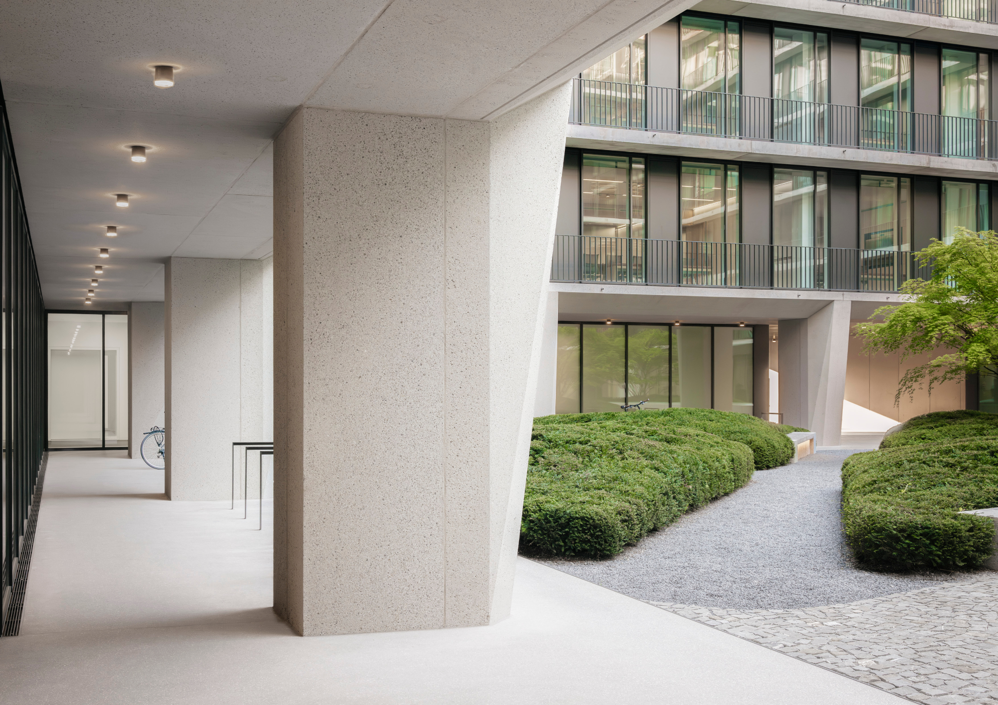 Completed building, courtyard, photographed in 2024